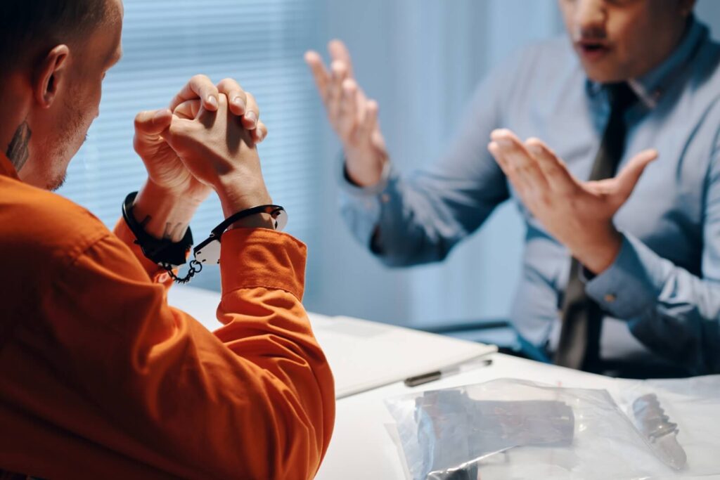A misdemeanor defense attorney in Dayton, Ohio, talks with his client